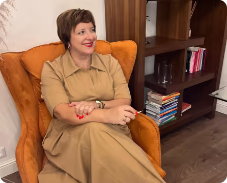 photo of alina in her office staying in her armchair
