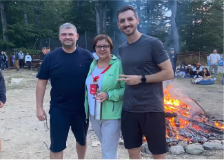 Alina with the other two professionals holding the camp