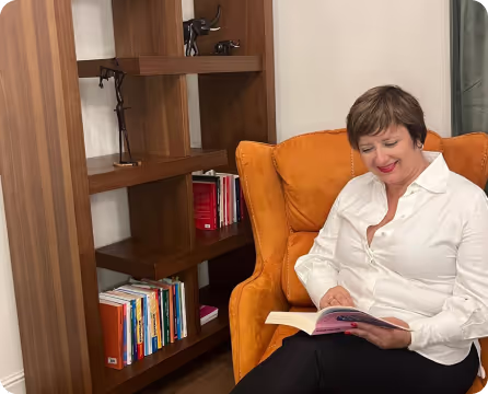 photo of alina in her office staying in her armchair
