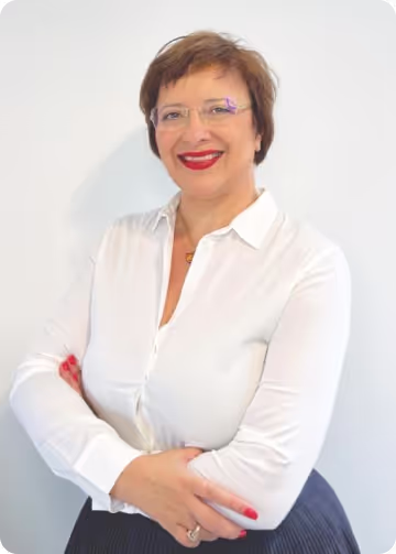 photo of alina used on the website. she is wearing a white blouse 
